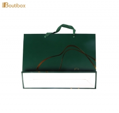 green paper bag with silk handle