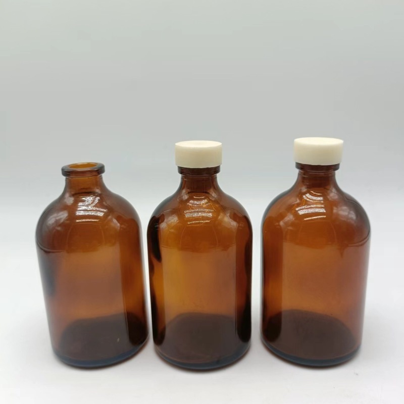 Wholesale 20ml 50ml 100ml amber empty molded injection glass bottles with cork