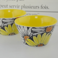 Yellow glazed interior with sunflower printing of irregularity ceramic bowl
