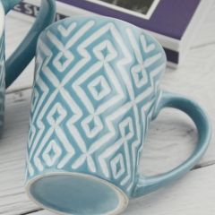 light blue 310ml mug with embossed rhombus design