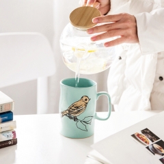 Hand-painted ceramic cups with flower and bird patterns