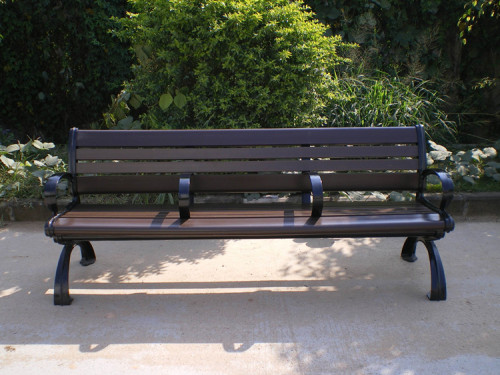 Outdoor park long metal and wood bench