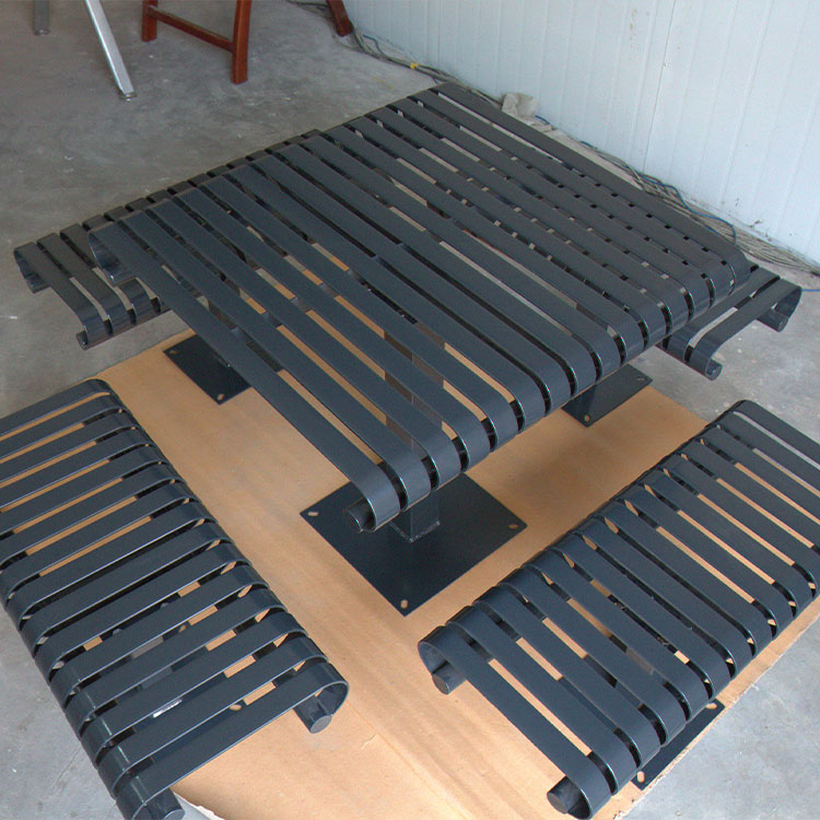 Slatted steel outdoor picnic table with bench