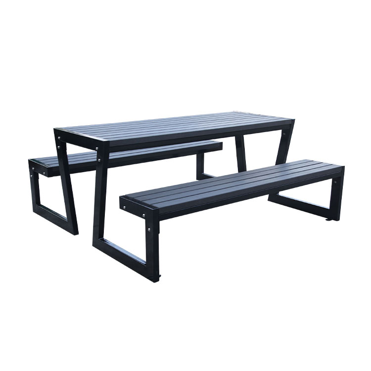Outdoor wood picnic table with attached bench seat
