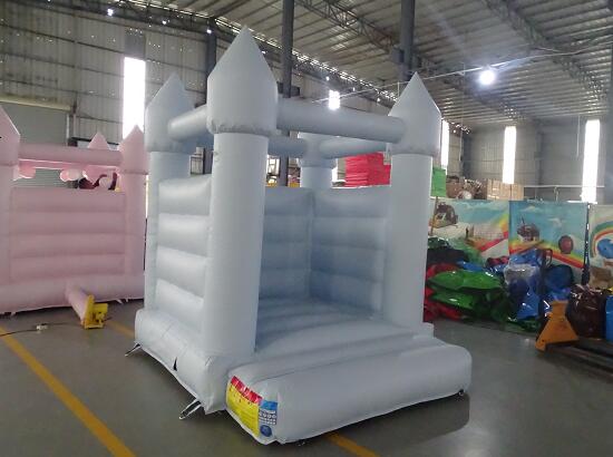 white bounce house with ball pit