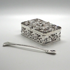 Silvery box with spoon