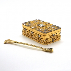Golden box with spoon