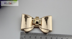 Simple custom bow-knot style gold turn lock for purse RL-BLK036