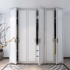 White painted casement closet with golden glazing