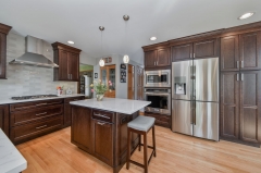 A traditional dark stained cherry wood kitchen -Allandcabinet