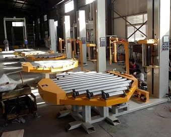 conveyorized turntable for pallet wrapping and forwarding