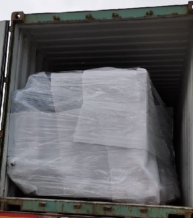 Pallet inverter and pallet flipper loaded by container for shipping