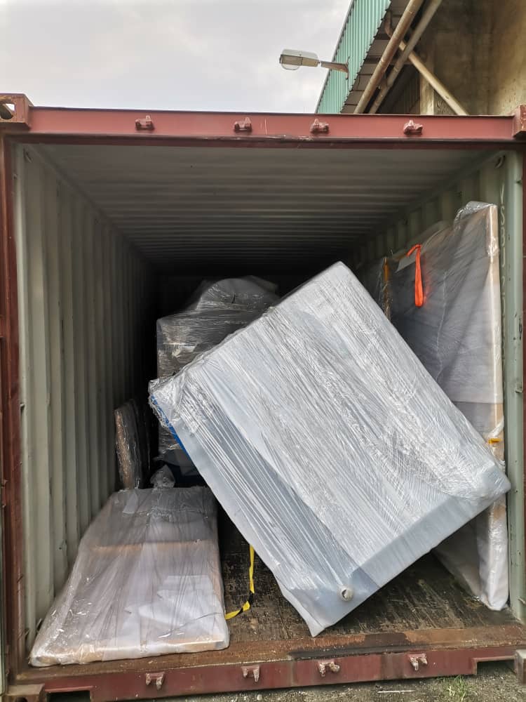 tipped machine of pallet changer inside container 