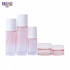 Venta al por mayor Gradient Pink Glass 30ml Frascos cosméticos y botellas de loción con bomba