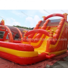 Orange inflatable bouncy castle with water double slides