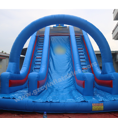 Large blue inflatable dry slide with arch