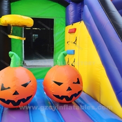 Halloween themed inflatable pumpkin castle slide combo