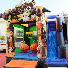 Halloween themed inflatable pumpkin castle slide combo