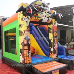 Halloween themed inflatable pumpkin castle slide combo