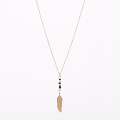 Black and white bead bar with gold feather necklace