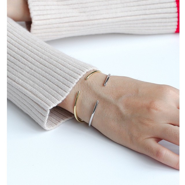 Minimalism cuff bracelet with cubic zirconia bezel each end in 14k gold plating