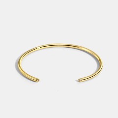 Minimalism cuff bracelet with cubic zirconia bezel each end in 14k gold plating