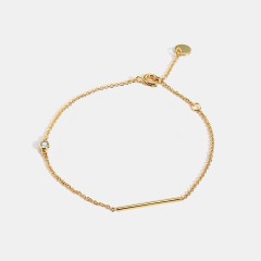 Wholesale Minimalist bracelet with bar and cubic zirconia bezel in 14k gold plating