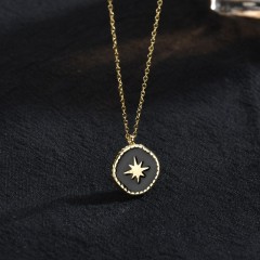 Gold and black resin starburst medallion necklace in stainless steel