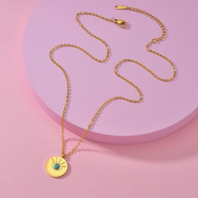 Eye medallion with turqoise stainless steel necklace in gold plating