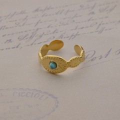 Turquoise in the eye opening ring in 14k gold plated stainless steel