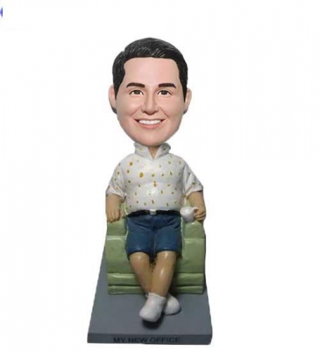 custom bobbleheads sitting in Sofa