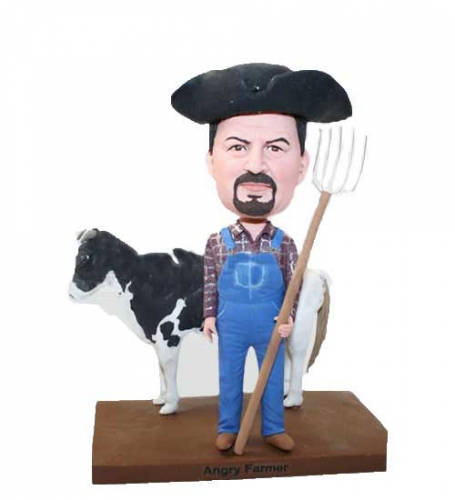Farmer bobbleheads with cow Rancher