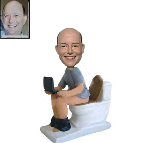 Custom bobblehead on toilet with laptop