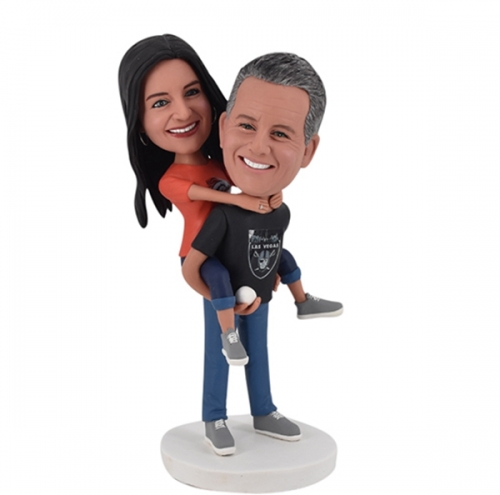 Custom Bobbleheads with woman in Denver Broncos shirt and man Las Vegas Raiders