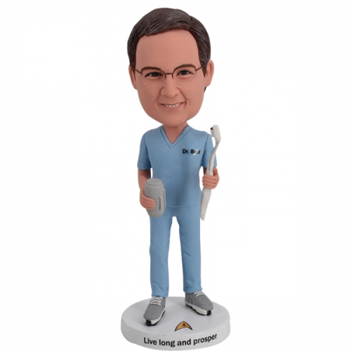 Dentist bobblehead with beer and brush