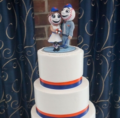 Custom Mr. and Mrs. Met wedding bobblehead cake topper