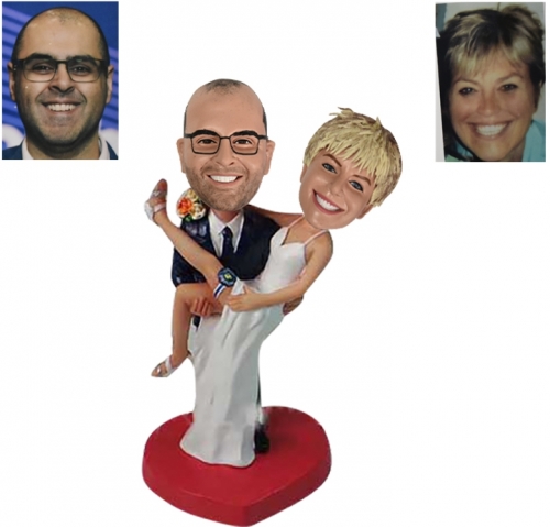 Groom carrying bride wedding cake toppers
