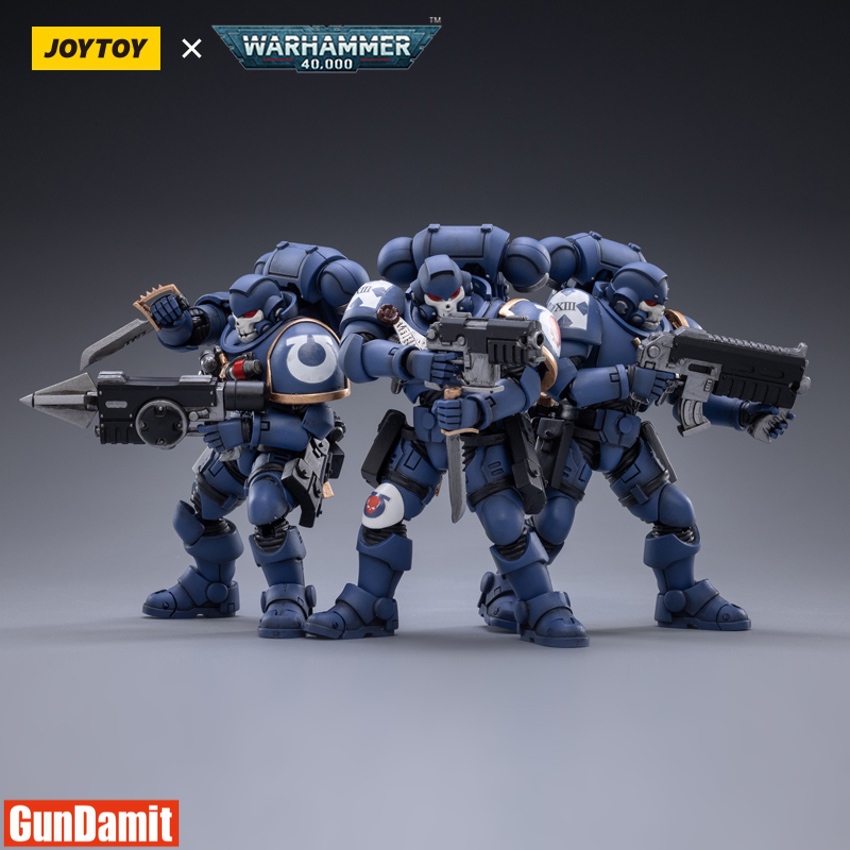 Three JoyToy Ultramarines Primaris Reivers in blue power armor with skull helmets wielding bolt carbines and combat blade Three JoyToy Ultramarines Primaris Reivers in blue power armor with skull helmets wielding bolt carbines and combat blade