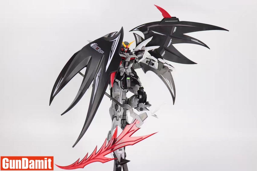 Rear three-quarter view of Deathscythe Hell with wings folded and scythe at ready Rear three-quarter view of Deathscythe Hell with wings folded and scythe at ready