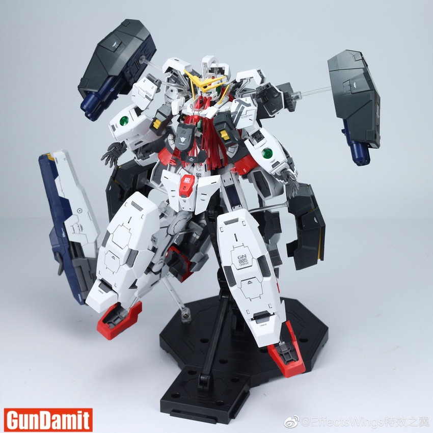 Effects Wings 1/100 Gundam Virtue Open Armor front view on black display base with GN Cannons deployed Effects Wings 1/100 Gundam Virtue Open Armor front view on black display base with GN Cannons deployed
