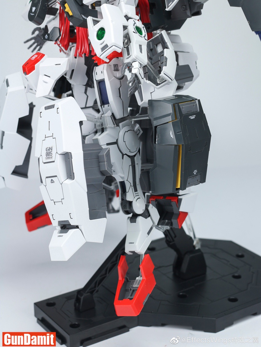Lower body detail of Virtue Open Armor on display base showing leg armor plates and red accent pieces Lower body detail of Virtue Open Armor on display base showing leg armor plates and red accent pieces
