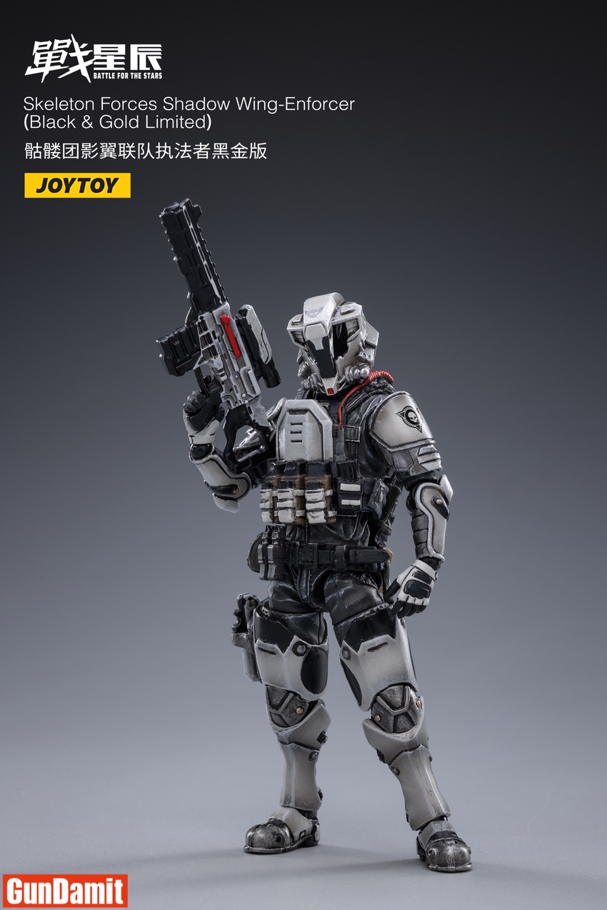 JoyToy Wing-Enforcer Black Gold side view holding gun upward JoyToy Wing-Enforcer Black Gold side view holding gun upward