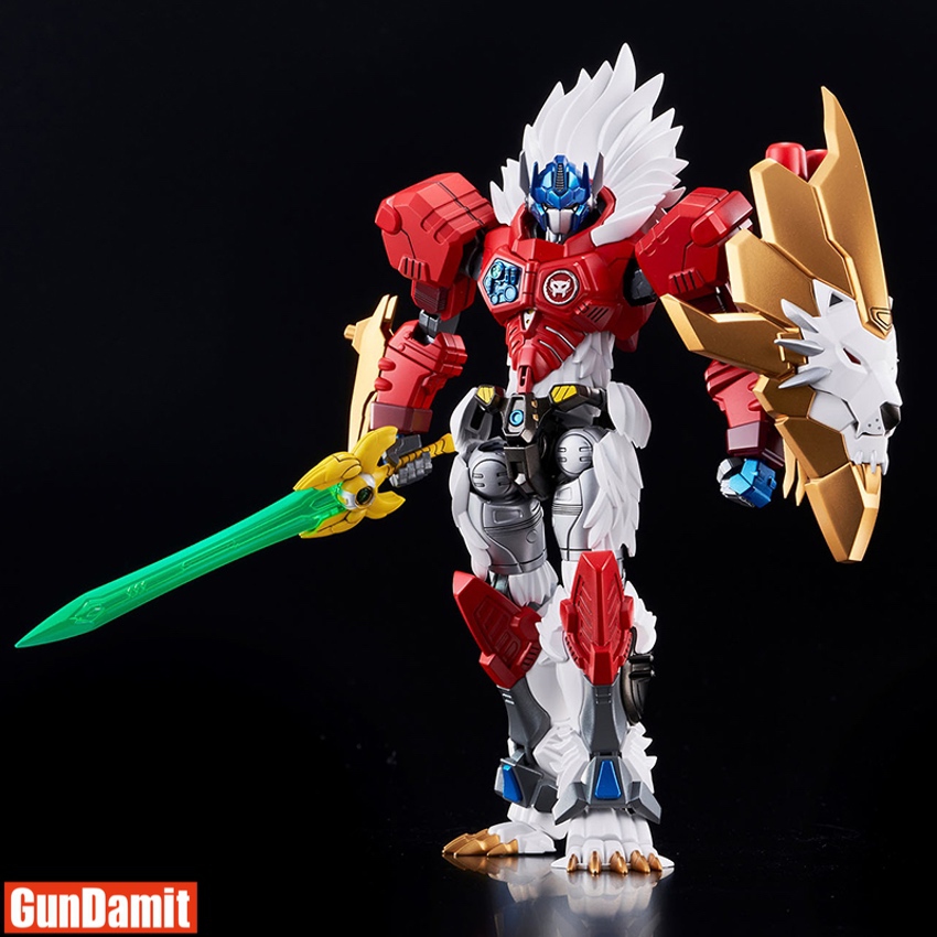 Assembled Flame Toys Leo Prime model front view wielding green energy sword and gold lion face shield Assembled Flame Toys Leo Prime model front view wielding green energy sword and gold lion face shield