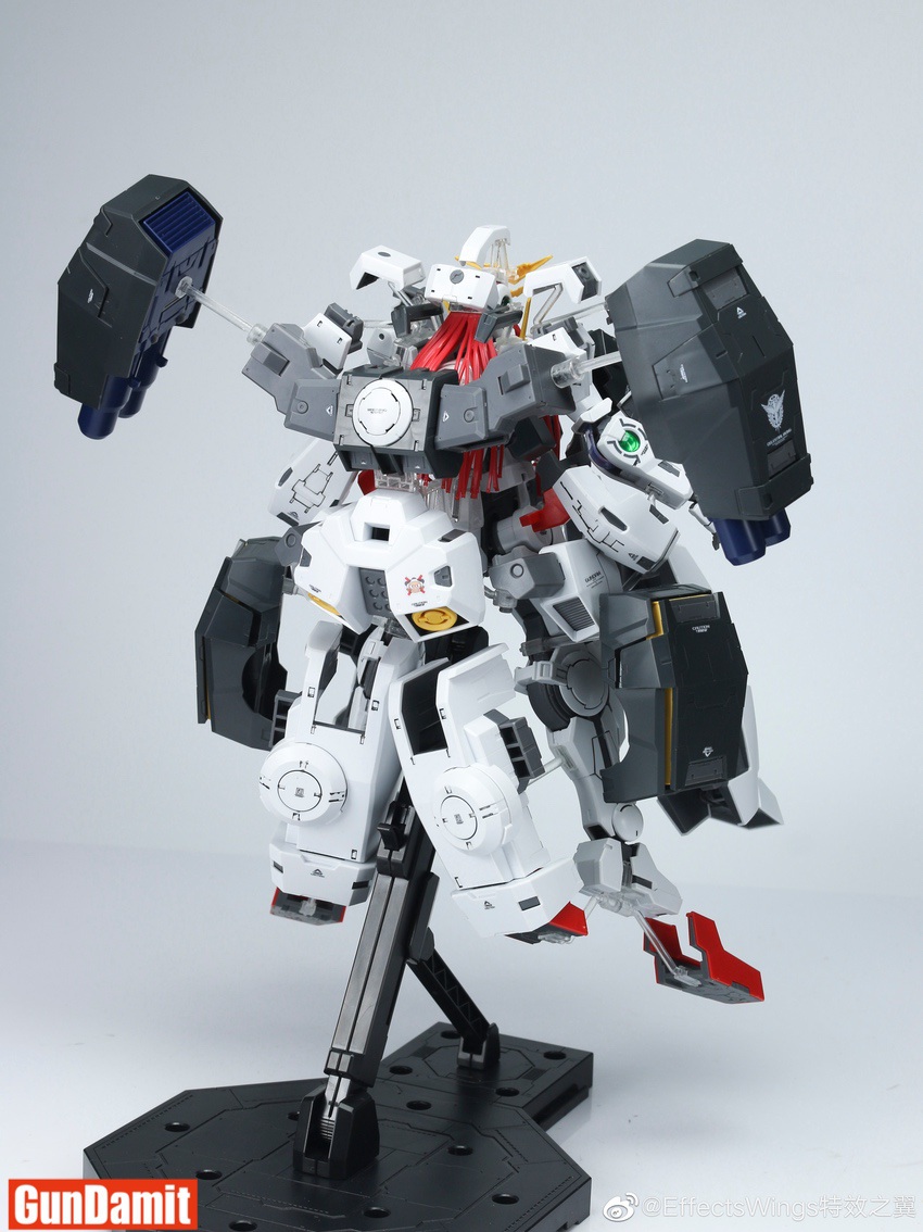 Dynamic angled pose of Virtue Open Armor highlighting GN Cannon arms and white-red armor separation Dynamic angled pose of Virtue Open Armor highlighting GN Cannon arms and white-red armor separation