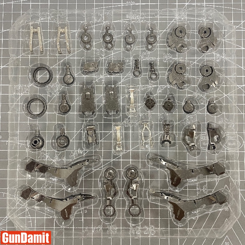 Point Factory Studio alloy upgrade parts for MG Barbatos laid out in blister tray showing joints and connectors Point Factory Studio alloy upgrade parts for MG Barbatos laid out in blister tray showing joints and connectors
