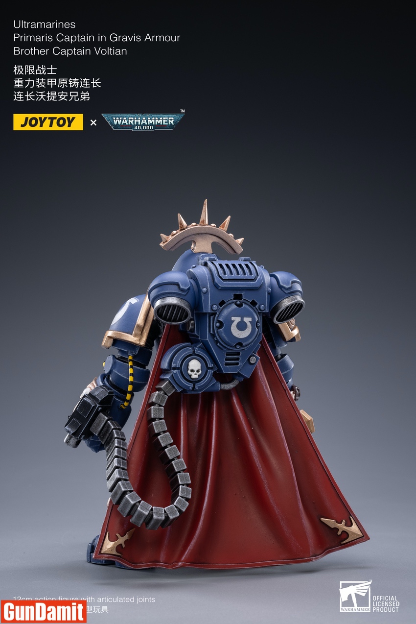 Captain Voltian rear view showing red cape draping over Gravis armour with Ultramarines chapter symbol backpack Captain Voltian rear view showing red cape draping over Gravis armour with Ultramarines chapter symbol backpack