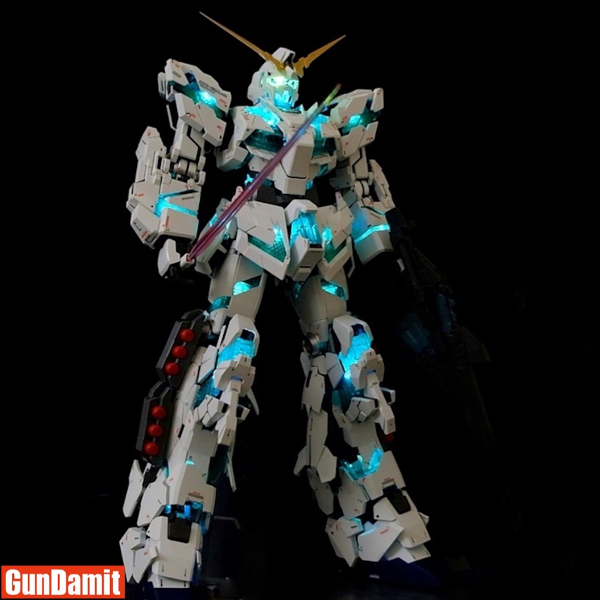 Kosmos Banshee LED kit showing cyan psychoframe glow with beam saber and shield accessories Kosmos Banshee LED kit showing cyan psychoframe glow with beam saber and shield accessories