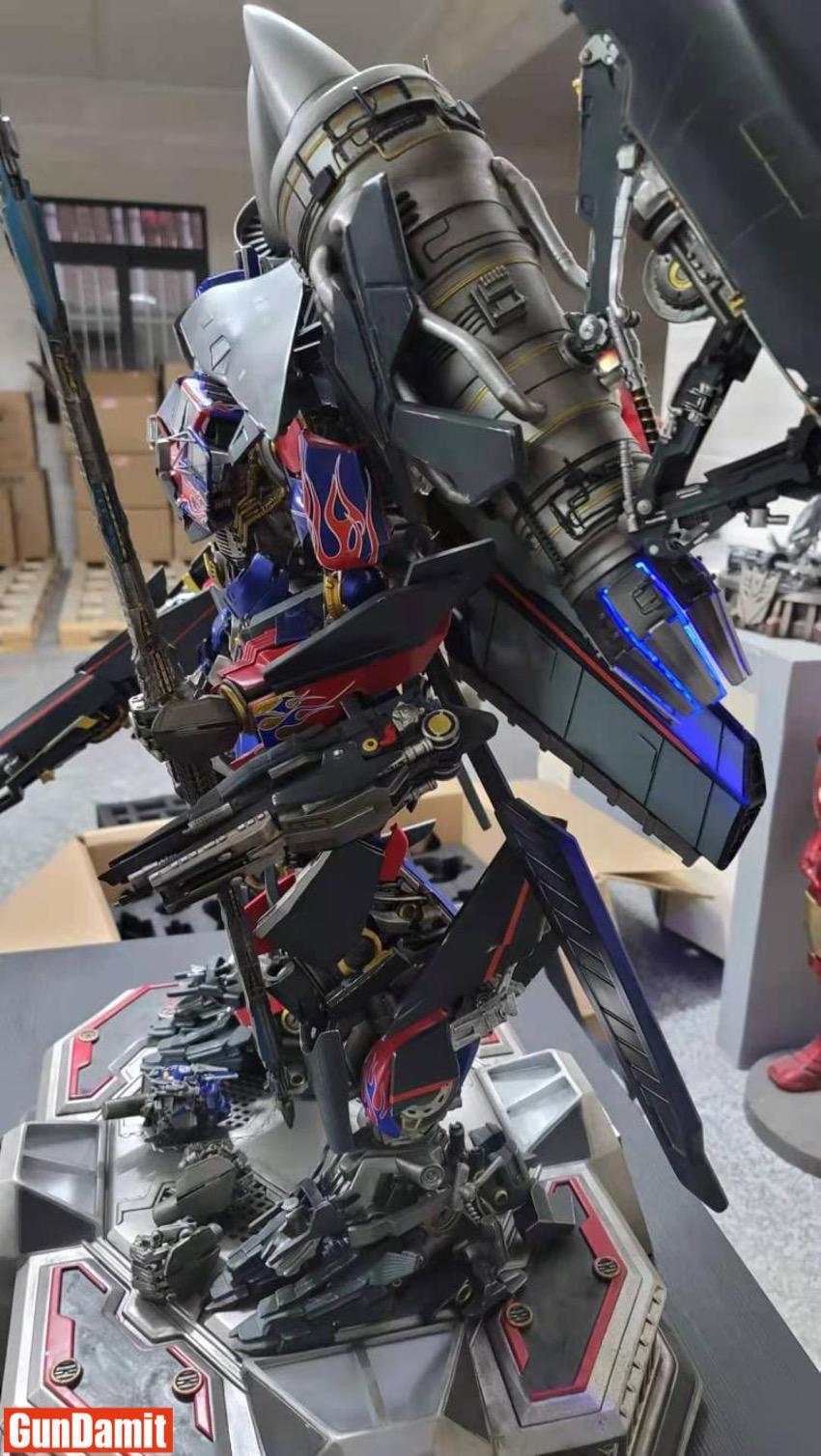 Side detail of HEAT Studio Jetpower Optimus Prime showing jet engine and flame decals Side detail of HEAT Studio Jetpower Optimus Prime showing jet engine and flame decals