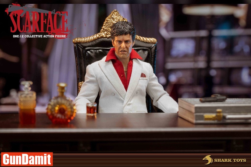 Scarface figure close-up seated at desk with liquor bottles Scarface figure close-up seated at desk with liquor bottles