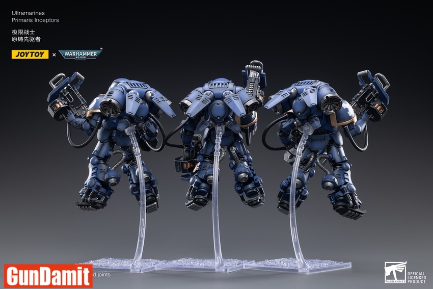 Three Ultramarines Primaris Inceptors rear view showing jump pack turbine details and blue power armor Three Ultramarines Primaris Inceptors rear view showing jump pack turbine details and blue power armor